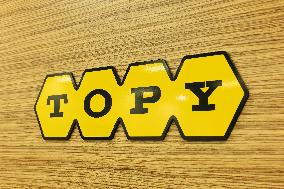 Topy Industries signboard and logo